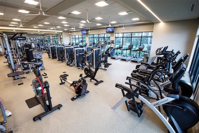 exercise room featuring a paneled ceiling and visible vents