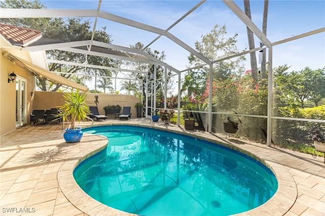 view of pool featuring a patio and a lanai