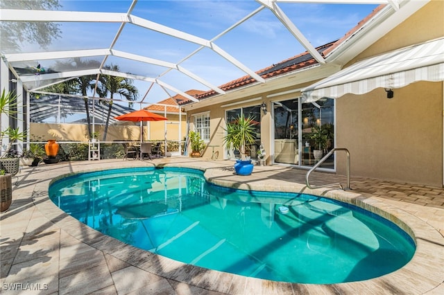 view of swimming pool with a patio and a lanai