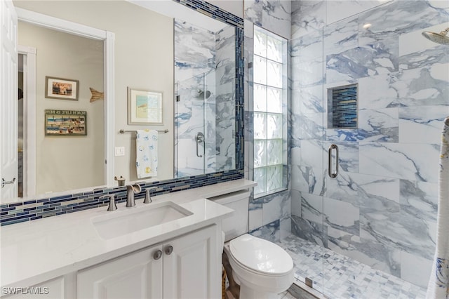 bathroom with an enclosed shower, toilet, tile walls, vanity, and decorative backsplash