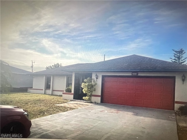 single story home featuring a garage