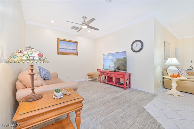 living room featuring light hardwood / wood-style floors, crown molding, and ceiling fan