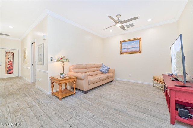 living room featuring crown molding, light hardwood / wood-style flooring, and ceiling fan