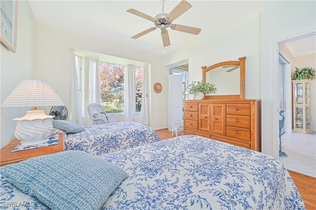 bedroom with ceiling fan and hardwood / wood-style floors