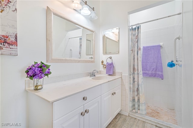 bathroom featuring vanity and a shower with curtain