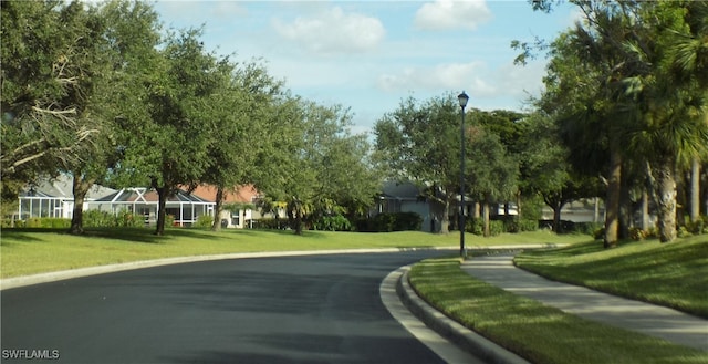 surrounding community featuring a yard