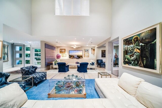 living room with a towering ceiling