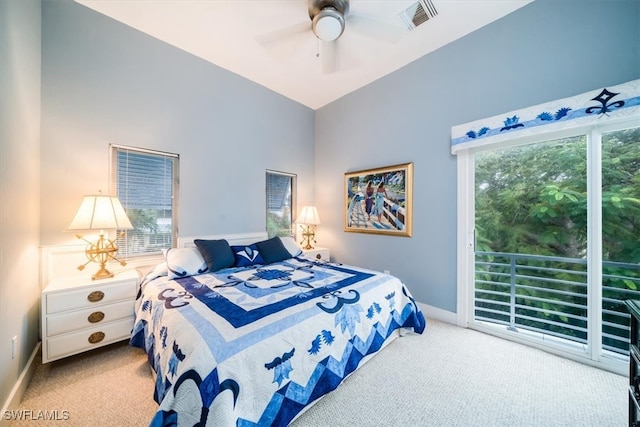 carpeted bedroom featuring ceiling fan and lofted ceiling