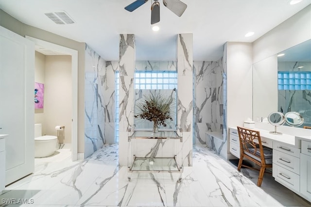 bathroom featuring vanity, toilet, walk in shower, and ceiling fan