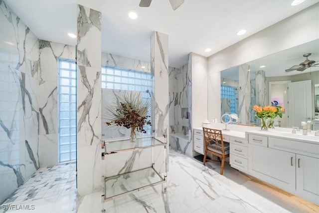 bathroom with vanity, ceiling fan, and walk in shower