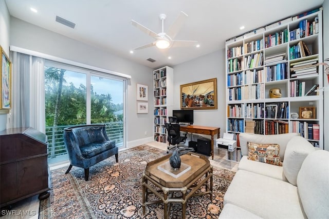 living area with ceiling fan