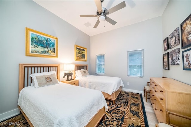 bedroom featuring lofted ceiling and ceiling fan