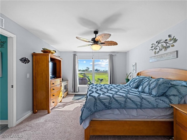 carpeted bedroom featuring ceiling fan