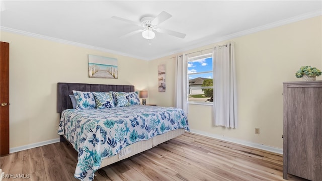 bedroom with ornamental molding, hardwood / wood-style flooring, and ceiling fan