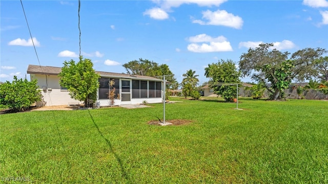 view of yard featuring a sunroom