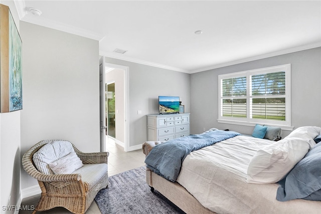 bedroom with crown molding and light tile patterned floors