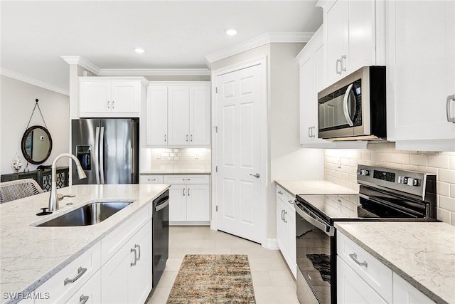 kitchen featuring white cabinetry, appliances with stainless steel finishes, and sink