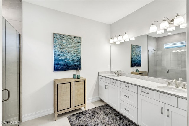 bathroom with vanity, tile patterned floors, and walk in shower