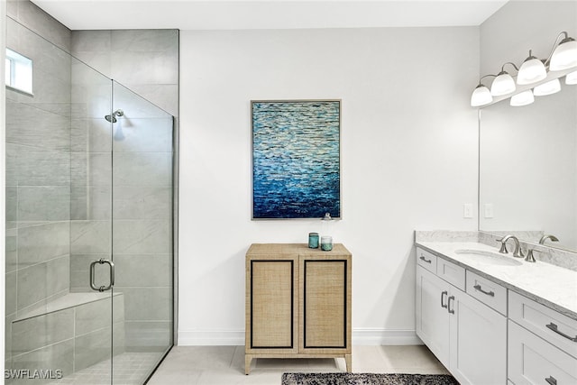 bathroom with vanity, tile patterned flooring, and a shower with door