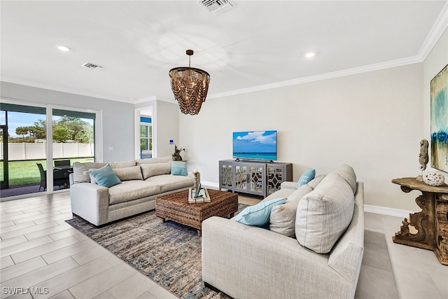 living room featuring a notable chandelier and crown molding