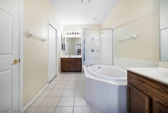 bathroom with plus walk in shower, vanity, and tile patterned floors