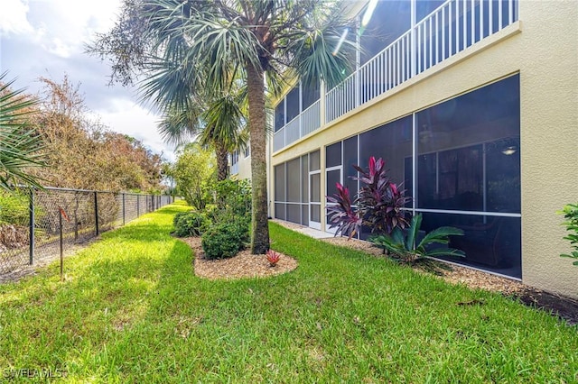 view of yard featuring a sunroom