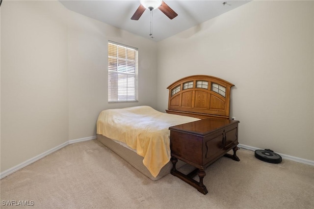 bedroom featuring ceiling fan and light carpet