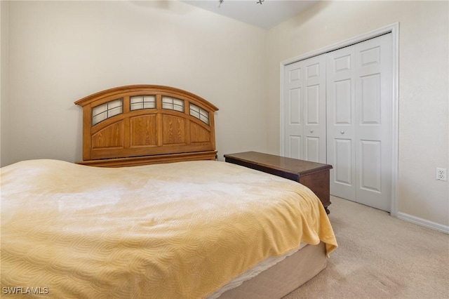 bedroom with a closet and carpet floors