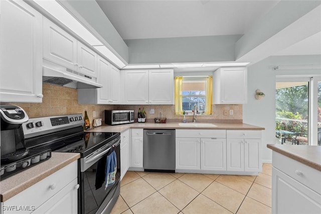 kitchen featuring sink, stainless steel appliances, and white cabinetry