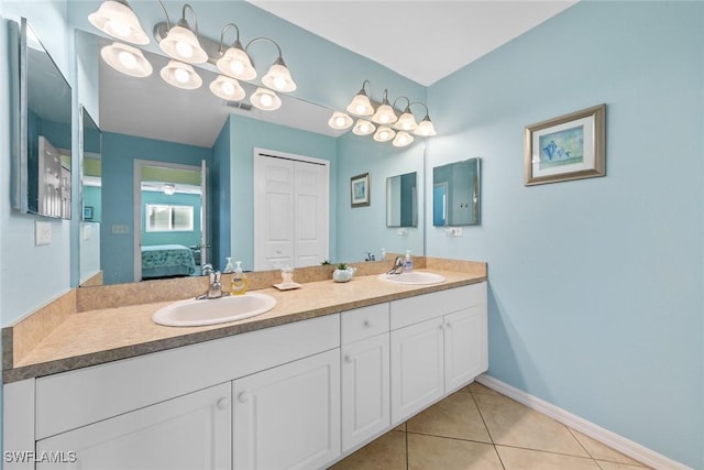 bathroom with vanity and tile patterned flooring