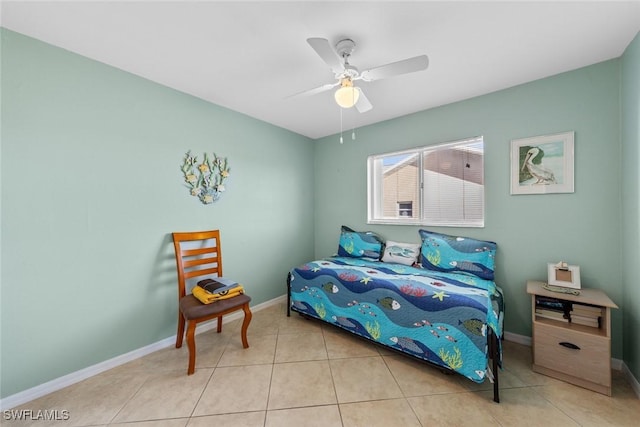 tiled bedroom featuring ceiling fan