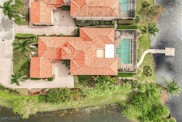 birds eye view of property with a water view