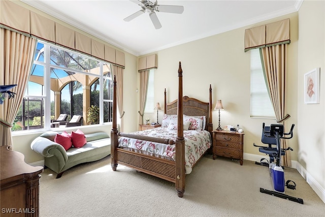 bedroom with carpet flooring, ceiling fan, and crown molding