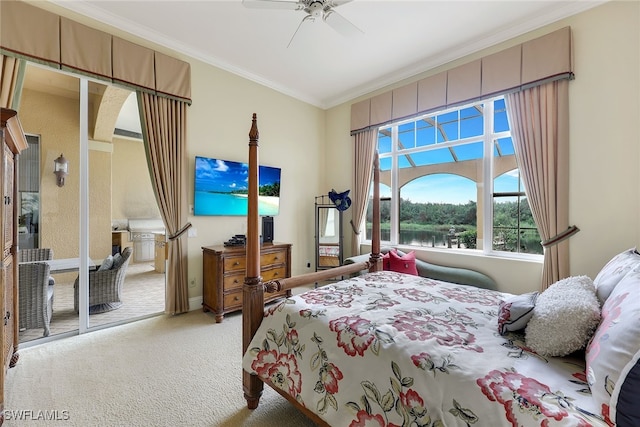 carpeted bedroom with ornamental molding, ceiling fan, and access to exterior