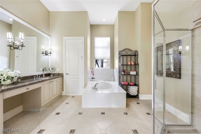 bathroom with plus walk in shower, vanity, and tile patterned flooring