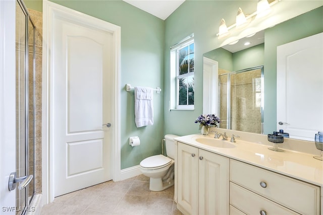 bathroom featuring vanity, tile patterned floors, toilet, and a shower with door