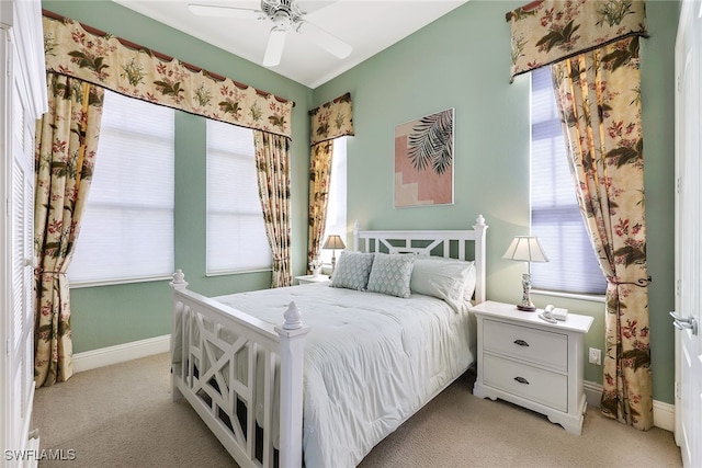 bedroom with light colored carpet and ceiling fan