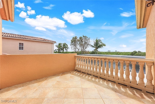 view of patio featuring a balcony