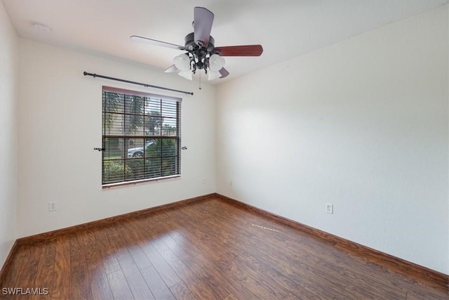 empty room with ceiling fan and hardwood / wood-style floors