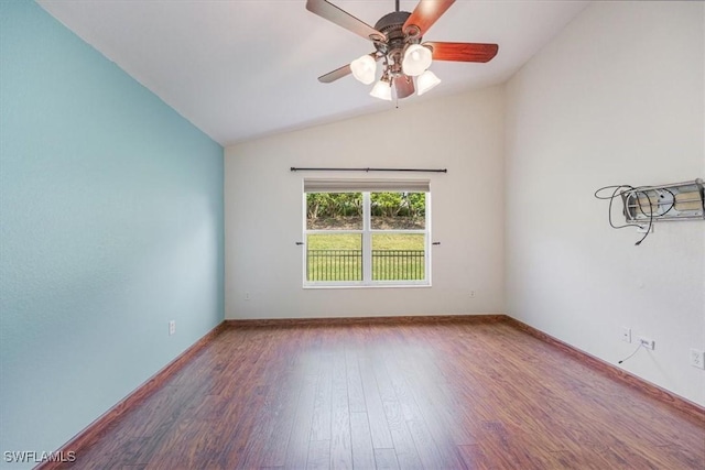 unfurnished room featuring ceiling fan, hardwood / wood-style floors, and vaulted ceiling