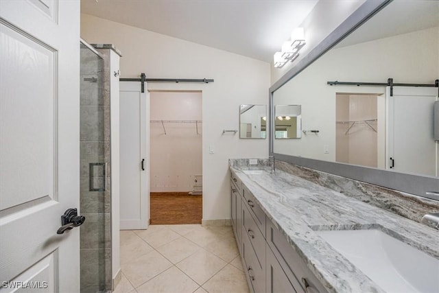 bathroom with lofted ceiling, an enclosed shower, vanity, and tile patterned floors