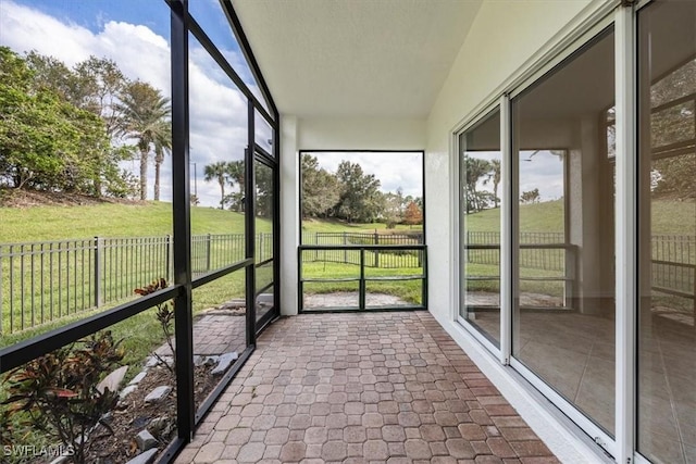 unfurnished sunroom with plenty of natural light