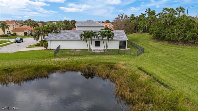 exterior space with a lawn and a water view