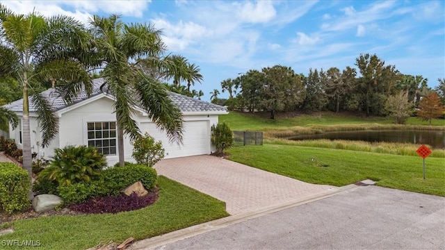 exterior space with a front yard and a garage