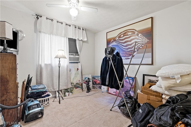 miscellaneous room featuring cooling unit, ceiling fan, and carpet floors