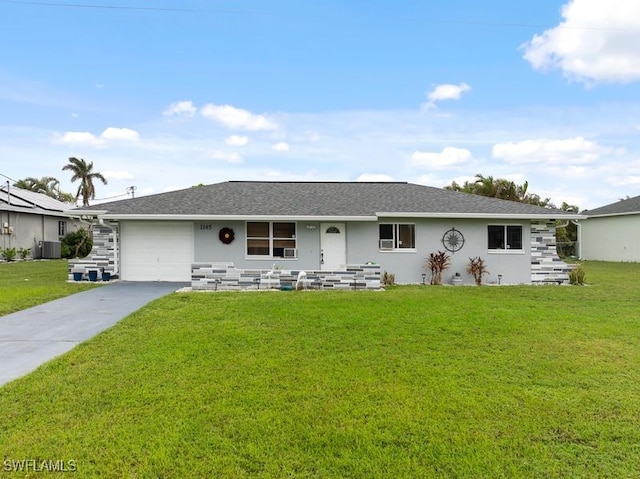 ranch-style home with a front yard, cooling unit, and a garage