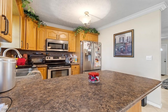 kitchen with ornamental molding, kitchen peninsula, and stainless steel appliances