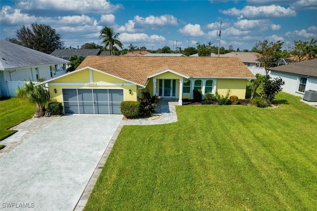 single story home featuring a garage and a front lawn