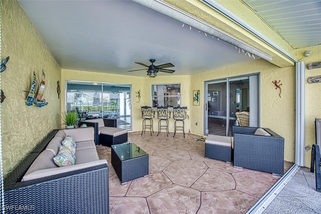 view of patio featuring outdoor lounge area and ceiling fan