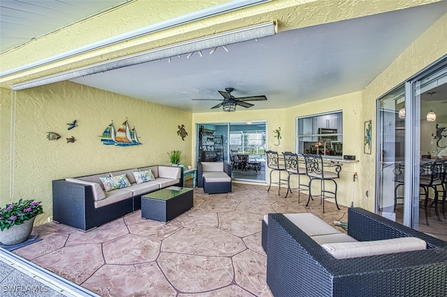 view of patio / terrace with an outdoor hangout area and ceiling fan